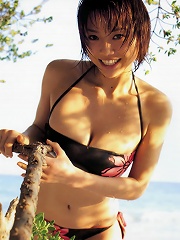 Busty asian babe is erotically beautiful in her printed bikini