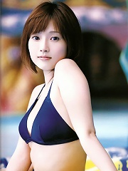 Beautiful asian goddess shows off her delicious body in a bikini